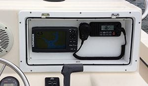 Marine electronics box holding gps fishfinder in dash of boat