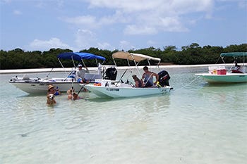 Boston Whaler 13 foot anchored at the sandbar