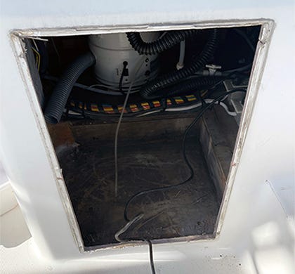 removed an old icemaker on the cockpit of a boat to install a new tackle box into the hole cutout