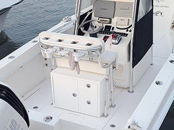 tackle box storage solution built into an aluminum leaning post for convenient storing of fishing gear while on the water