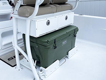 tackle box storage solution built into an aluminum leaning post on a boat for convenient storing of fishing gear while on the water