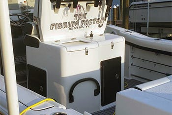 Custom aluminum footrest built into the leaning post of a center console.