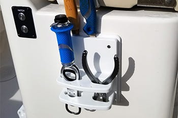 tool holder solution built into a boat for convenient storing of fishing gear while on the water