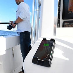 ROKK Wireless Active phone charger mounted to the boat dash