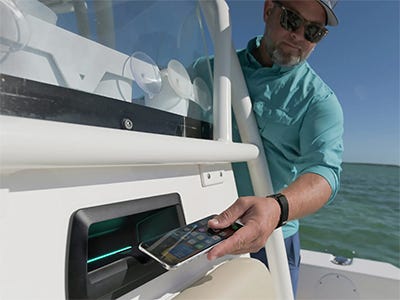 wireless phone charger cove installed to the console of a boat