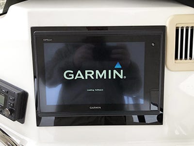 Acrylic trim plate mounted behind a Garmin unit