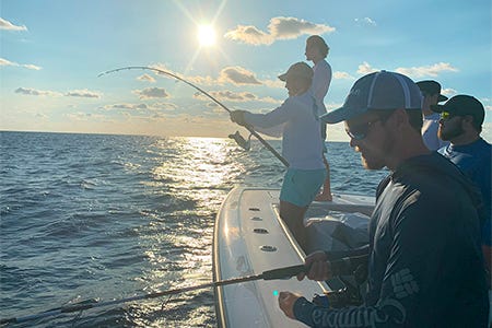 enjoying and learning new fishing tricks with a captain