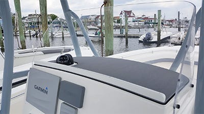 keeper strips installed to the front of the helm to keep items in place when underway