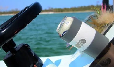 Toadfish suctioning non-slip and spill resistant can cooler and coozie being used on a fishing boat 